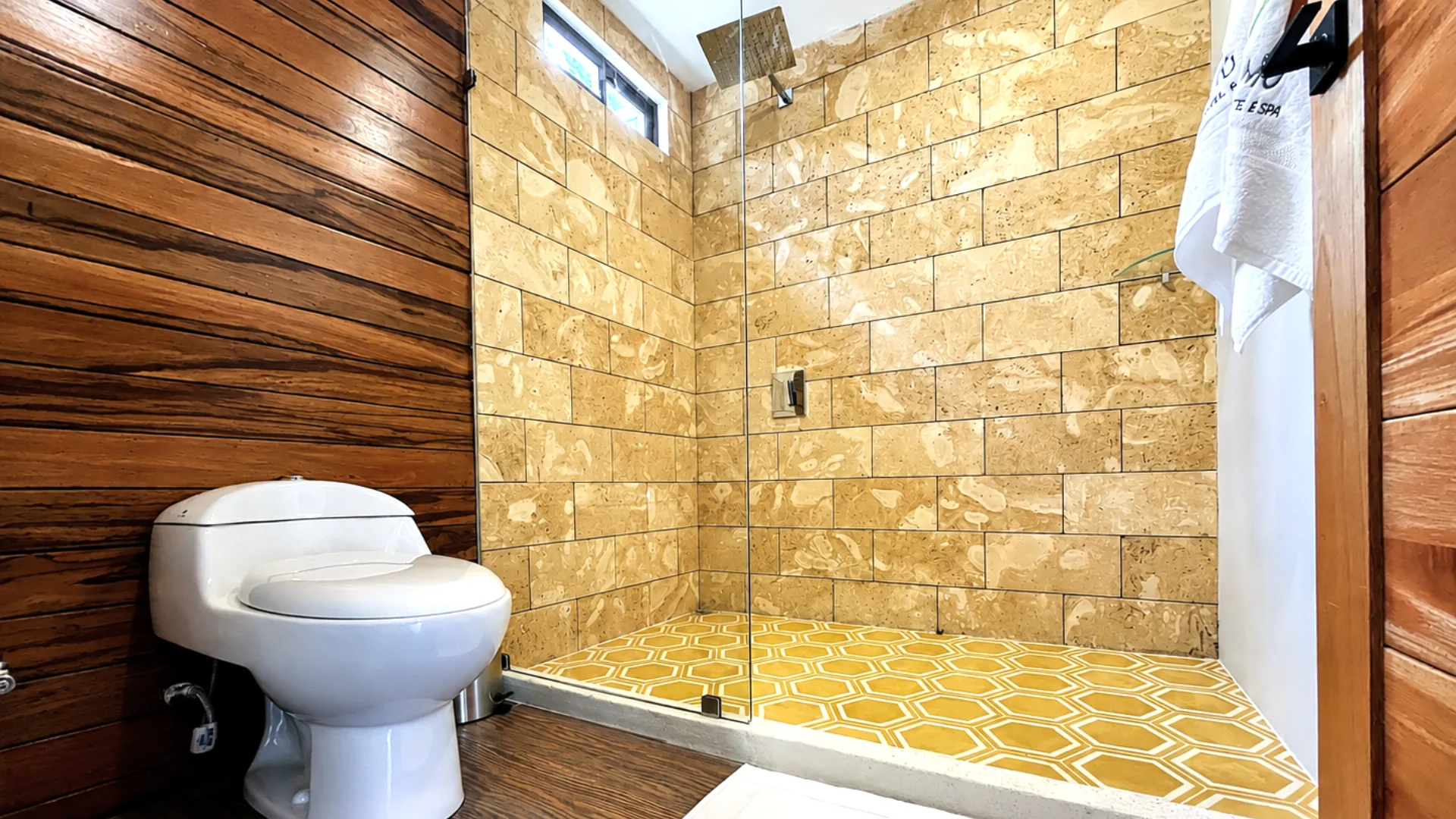 Stone-lined shower inside Casa Namú