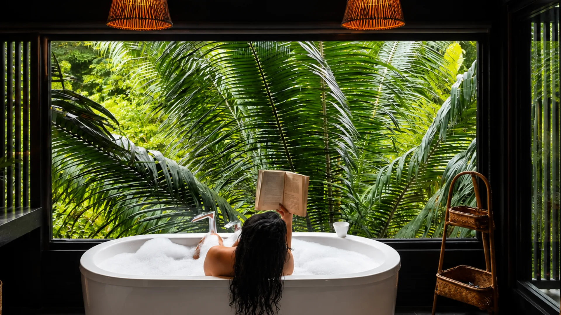 Luxury Suite bathtub beside a window overlooking the garden