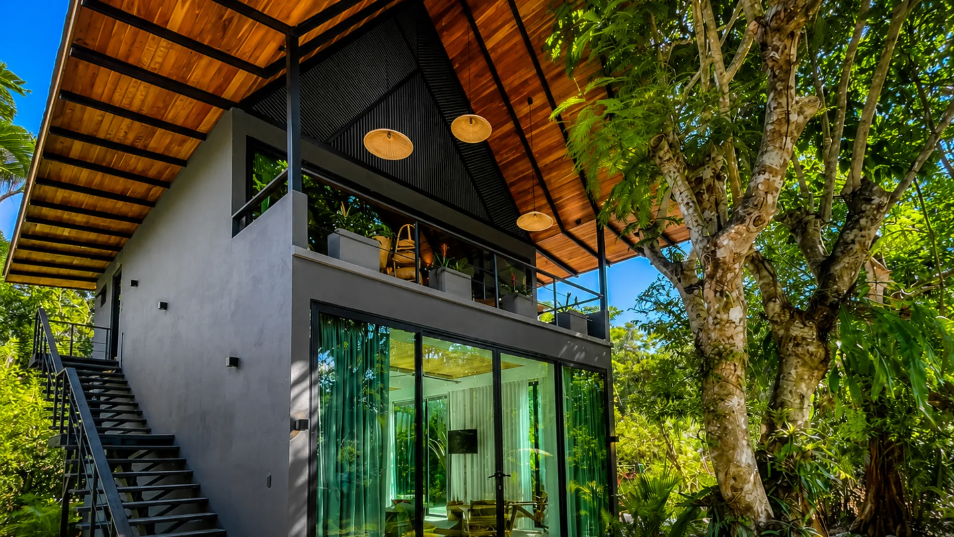 Contemporary suite building among tropical trees